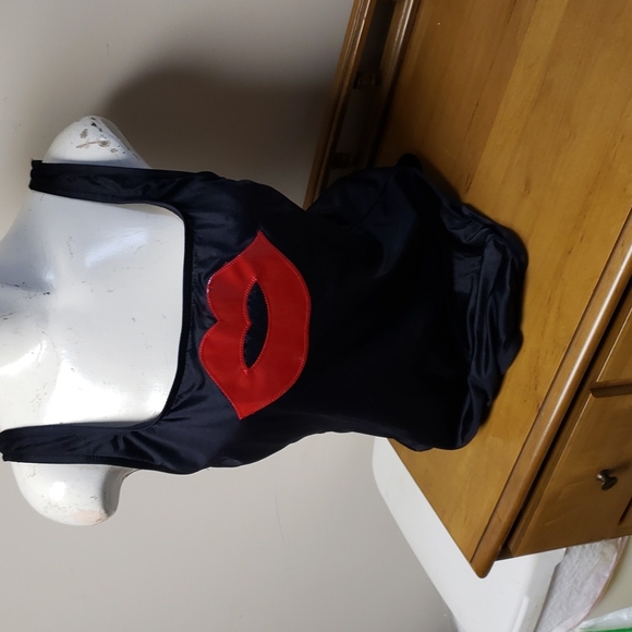 Black swimsuit with red lacing up the back. - Picture 1 of 3